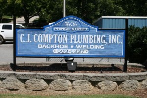 sign C J Compton Plumbing Inc